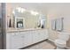 Bright bathroom featuring a double vanity and modern fixtures at 5674 Palmer Circle Dr # 203, Bradenton, FL 34211
