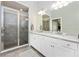 Modern bathroom featuring double sinks, sleek shower, and neutral decor at 5674 Palmer Circle Dr # 203, Bradenton, FL 34211