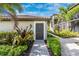 Inviting entrance with landscaped path and exterior door at 5674 Palmer Circle Dr # 203, Bradenton, FL 34211