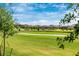 Scenic view of a well-manicured golf course with lush green grass and blue skies at 5674 Palmer Circle Dr # 203, Bradenton, FL 34211