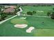 Lush golf course at Lakewood National with sand traps and players visible at 5674 Palmer Circle Dr # 203, Bradenton, FL 34211