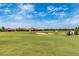 Scenic golf course with sand traps, lush green fairways, and clear blue skies at 5674 Palmer Circle Dr # 203, Bradenton, FL 34211