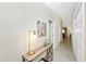 Stylish hallway with modern decor, table lamp and tiled floors at 5674 Palmer Circle Dr # 203, Bradenton, FL 34211