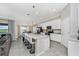 Bright, spacious kitchen features a large island with seating and modern appliances at 5674 Palmer Circle Dr # 203, Bradenton, FL 34211