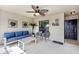 Comfortable screened porch featuring stylish furniture, fan, and a welcoming 