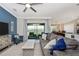 Comfortable living room features modern decor and a sliding glass door to the patio at 5674 Palmer Circle Dr # 203, Bradenton, FL 34211