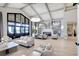 Spacious lounge area with comfortable seating, a fireplace, and elegant design at 5674 Palmer Circle Dr # 203, Bradenton, FL 34211