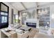 Inviting lounge featuring a modern fireplace, elegant seating, and upscale decor at 5674 Palmer Circle Dr # 203, Bradenton, FL 34211