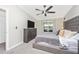 Beautifully lit main bedroom with a ceiling fan, dresser, and plush bed at 5674 Palmer Circle Dr # 203, Bradenton, FL 34211