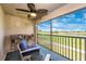Relaxing outdoor patio offers golf course views, comfortable seating, and a fan at 5674 Palmer Circle Dr # 203, Bradenton, FL 34211