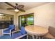 Covered outdoor patio offers comfortable seating and golf course views at 5674 Palmer Circle Dr # 203, Bradenton, FL 34211
