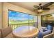 Relaxing patio with a ceiling fan and picturesque golf course view at 5674 Palmer Circle Dr # 203, Bradenton, FL 34211