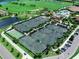 Aerial view showcases numerous tennis courts at Lakewood National community at 5674 Palmer Circle Dr # 203, Bradenton, FL 34211
