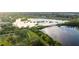 Scenic aerial view of the lake and lush green landscapes at 57 Sandstone Cir, Venice, FL 34293