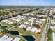 Community aerial view showing landscaping, water features, and an ideal location at 57 Sandstone Cir, Venice, FL 34293