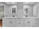 Elegant bathroom vanity with double sinks, marble countertop, and ample storage space at 57 Sandstone Cir, Venice, FL 34293