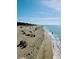 Ocean scene of beach with ocean waves and blue sky on sunny day at 57 Sandstone Cir, Venice, FL 34293