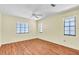 Bright bedroom with hardwood floors and a ceiling fan at 57 Sandstone Cir, Venice, FL 34293