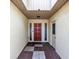 Bright entryway with a decorative front door and tile flooring at 57 Sandstone Cir, Venice, FL 34293