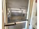 Spacious garage with ample storage space and side access door at 57 Sandstone Cir, Venice, FL 34293