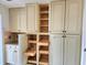 Bright kitchen cabinets featuring pull-out shelving offer plenty of storage at 57 Sandstone Cir, Venice, FL 34293