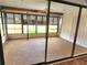 Enclosed lanai with multiple windows and blinds at 57 Sandstone Cir, Venice, FL 34293