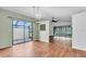 Open living room with hardwood floors, screened in porch and lots of natural light at 57 Sandstone Cir, Venice, FL 34293