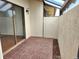 Private outdoor patio with tiled flooring and privacy wall at 57 Sandstone Cir, Venice, FL 34293