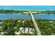 Aerial real estate shot overlooking the waterway and beach at 5832 Monroe Rd, Venice, FL 34293