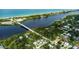 Aerial real estate shot of homes near the waterway leading to the beach at 5832 Monroe Rd, Venice, FL 34293