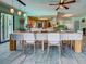A bright dining room with an open floorplan and access to the kitchen at 5832 Monroe Rd, Venice, FL 34293