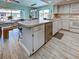 Kitchen view with tile floor, stainless steel dishwasher, and open dining area at 5832 Monroe Rd, Venice, FL 34293