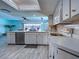 Kitchen view with bar-style countertop and lots of natural light at 5832 Monroe Rd, Venice, FL 34293