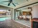 View of the dining room leading to the lanai and pool, creating a seamless indoor-outdoor living space at 5832 Monroe Rd, Venice, FL 34293