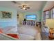 Bright living room features a large window, cozy seating, a TV, and built-in shelving at 5832 Monroe Rd, Venice, FL 34293