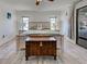 The primary bedroom features wood-look floors, shiplap accents, and lots of natural light at 5832 Monroe Rd, Venice, FL 34293