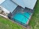 Aerial view of the screened pool with a serene, private backyard space at 5832 Monroe Rd, Venice, FL 34293