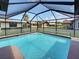 Sparkling screened-in pool with crystal clear water, offers a perfect spot for relaxation and recreation at 5832 Monroe Rd, Venice, FL 34293