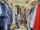 Spacious walk-in closet with organized shelving, racks, and space for ample storage at 5832 Monroe Rd, Venice, FL 34293