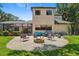 A backyard featuring a cozy fire pit area with comfortable seating, and a screened-in patio with a pool at 5850 Saddle Oak Trl, Sarasota, FL 34241