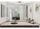 Spacious bathroom with a large mirror over a vanity, offering great lighting and a serene atmosphere at 5850 Saddle Oak Trl, Sarasota, FL 34241