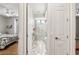 Stylish bathroom features a glass-enclosed shower with marble tile, a vanity, and access to the bedroom at 5850 Saddle Oak Trl, Sarasota, FL 34241