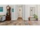 Spacious hallway featuring tiled floors, elegant decor, and seamless flow to other rooms at 5850 Saddle Oak Trl, Sarasota, FL 34241