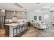 Open kitchen with island, modern cabinets, and an open floor plan at 5850 Saddle Oak Trl, Sarasota, FL 34241