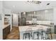 Kitchen featuring modern lighting, a center island, and stainless steel appliances at 5850 Saddle Oak Trl, Sarasota, FL 34241