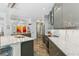 Kitchen with island, stone countertops, stainless steel appliances, and modern finishes at 5850 Saddle Oak Trl, Sarasota, FL 34241