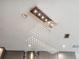 Close up of modern drop lighting with recessed lights and ventilation at 5850 Saddle Oak Trl, Sarasota, FL 34241