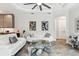 Open living room featuring modern sofas, unique coffee table, and contemporary art enhancing the stylish interior at 5850 Saddle Oak Trl, Sarasota, FL 34241
