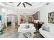 Bright living room with tile floors, modern furniture, and an open floor plan at 5850 Saddle Oak Trl, Sarasota, FL 34241