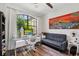 Bright office space with large window, modern desk, and comfortable seating, perfect for working from home at 5850 Saddle Oak Trl, Sarasota, FL 34241
